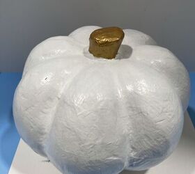 If you're tired of loud and garish pumpkins, here's a delicate design that will give your fall display some class