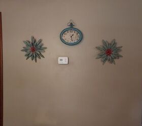 How do  decorate a wall with thermostat in the middle?
