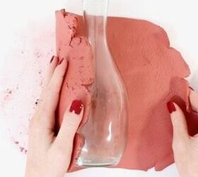 The high-end reason she wraps a slab of clay around an empty glass bottle