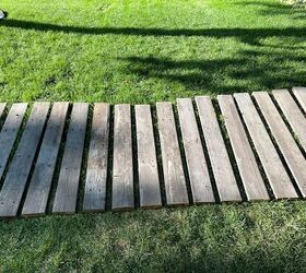 She uses 18 fence pickets to create this secret secluded garden space