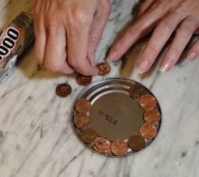 Glue pennies to can lids to copy this interesting decor idea