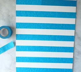 This classic fall decor idea starts with putting lines of tape on a canvas