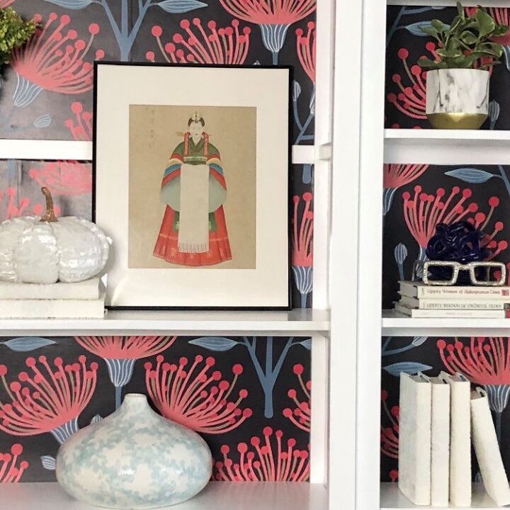 an easy and dramatic bookshelf makeover using wallpaper