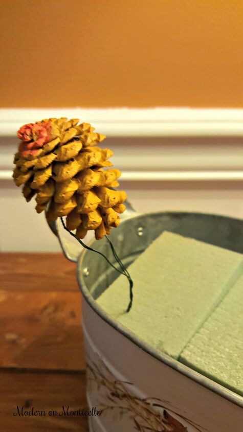 fall floral arrangement with painted pine cones