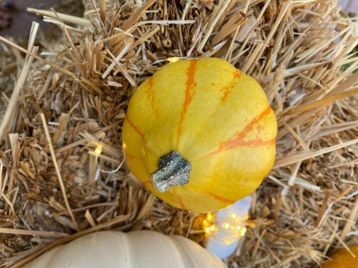 fall door decor using hay bales and fairy lights