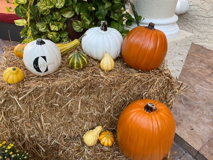 fall door decor using hay bales and fairy lights