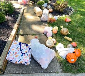 She lays her giant faux pumpkin collection on her walkway for this gorgeous fall idea