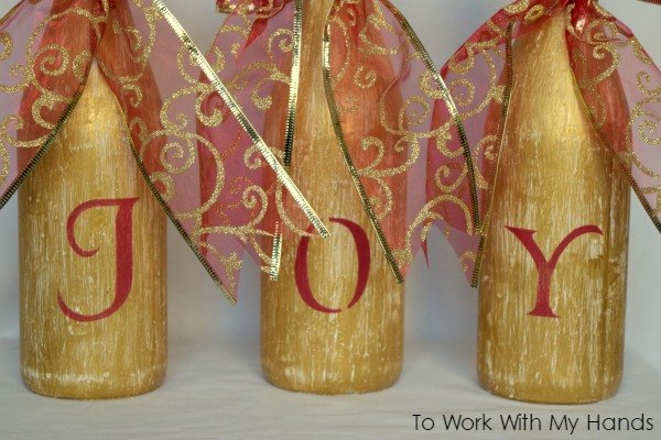 s 16 clever upcycles that resulted in expensive looking decor, Some festive Christmas bottle decor