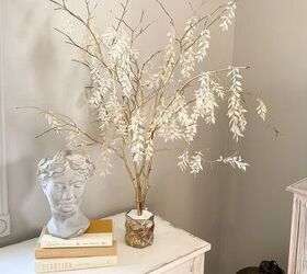 s 18 genius ways to get the anthropologie look on a budget, Make twinkling branch lights