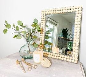 s 18 genius ways to get the anthropologie look on a budget, Glue wooden balls to a mirror