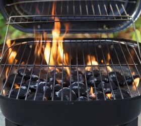 how to clean a grill for your best barbecue season yet, Lit charcoal grill