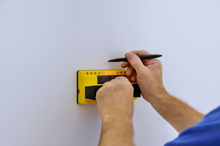 how to find a stud in the wall with and without a stud finder, hand marking spot on wall using a stud finder