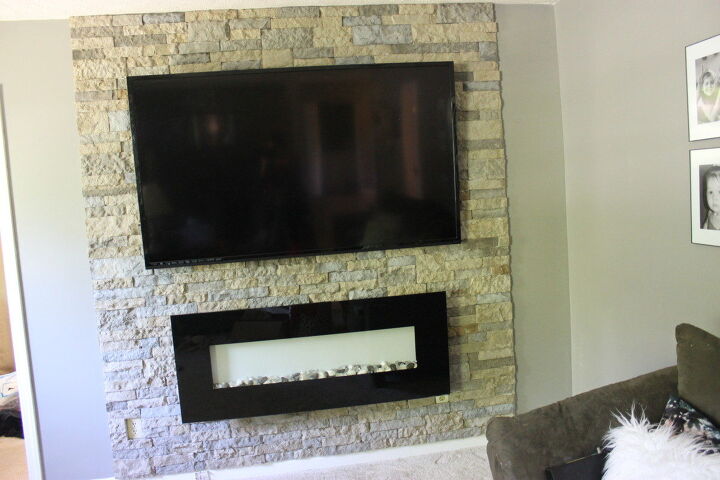 s 12 inspiring ways to decorate around a tv, Install a dramatic stone veneer accent wall
