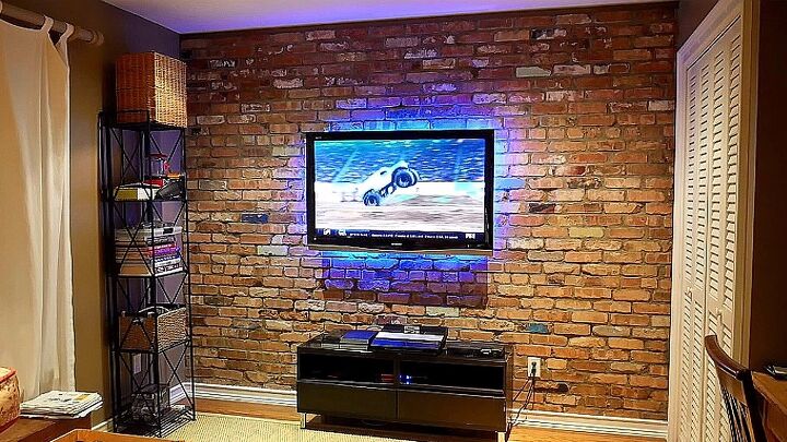 s 12 inspiring ways to decorate around a tv, Cover your wall in lovely bricks
