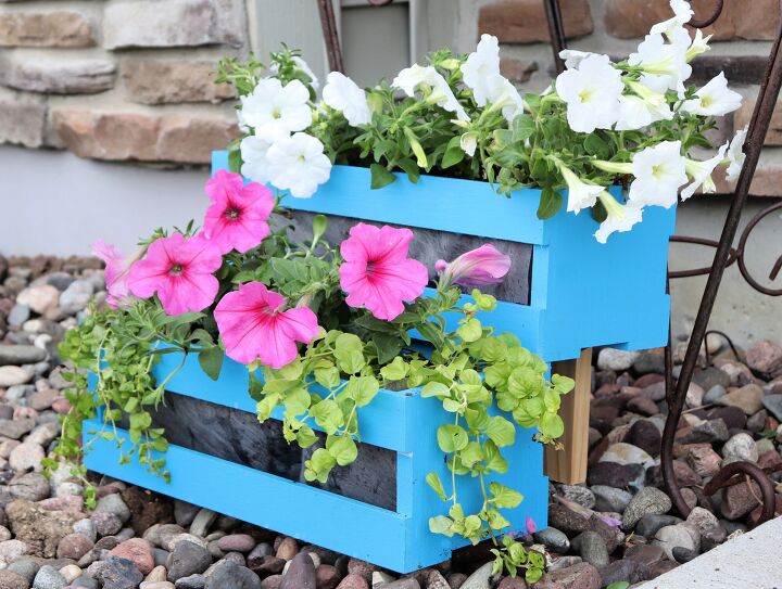 s 10 incredible ways to turn michaels crates into home decor, A cute colorful planter