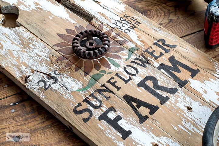 build a cute fall sunflower sign with shelf from fence pickets, Adding rusty junk for a 3D effect
