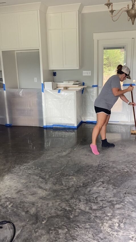 acid staining concrete floors, Brushing the stain into the grooves