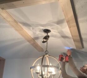 She hangs a wood frame around her light fixture for this gorgeous, inexpensive update