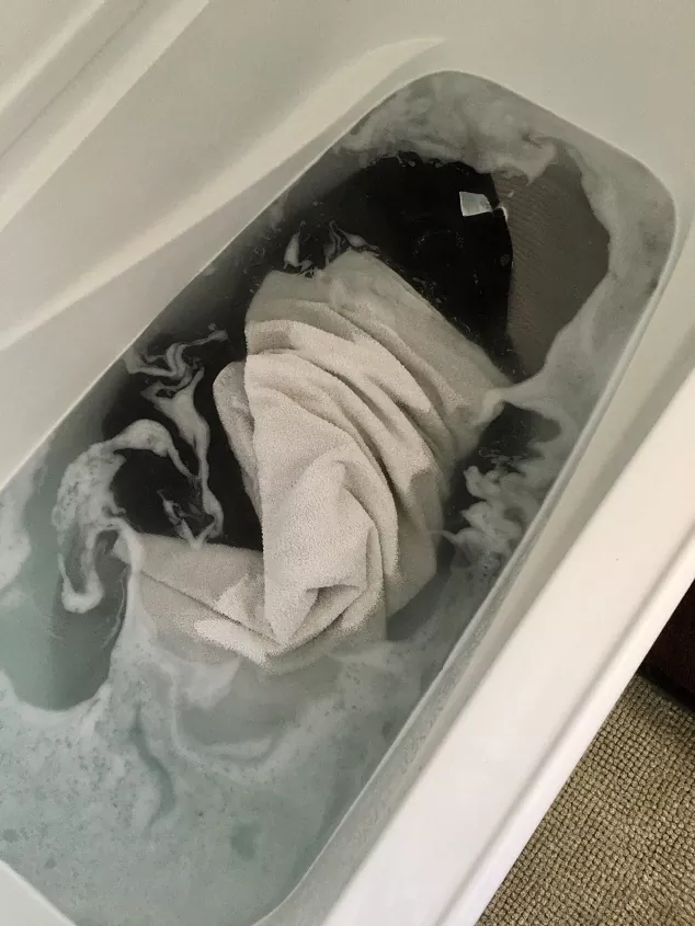 how to strip your laundry, dirty laundry in water filled bathtub