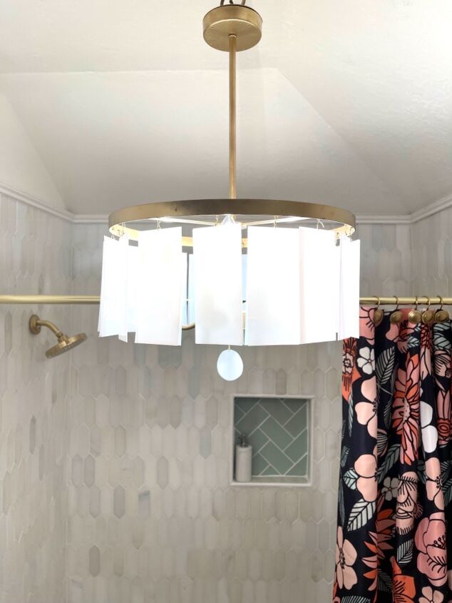 s 15 showstopping ideas that ll make guests gather in your bathroom, Hang a fancy chandelier