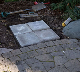 They start by laying 4 pavers in their garden bed & end up with this gorgeous feature