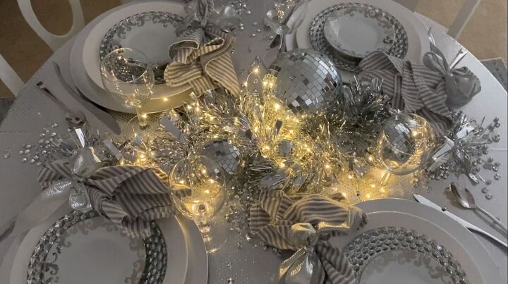 s 14 magical ways to use your holiday lights this season, Her glittering holiday tablescape