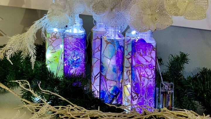 s 14 magical ways to use your holiday lights this season, Her beautiful fairy light bottles