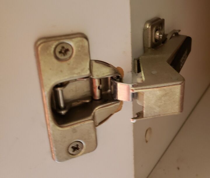 q how to fix kitchen corner cabinet hinge