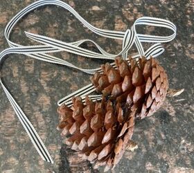 You'll need a few pine cones, some ribbon, and an old sled to copy this adorable winter accent