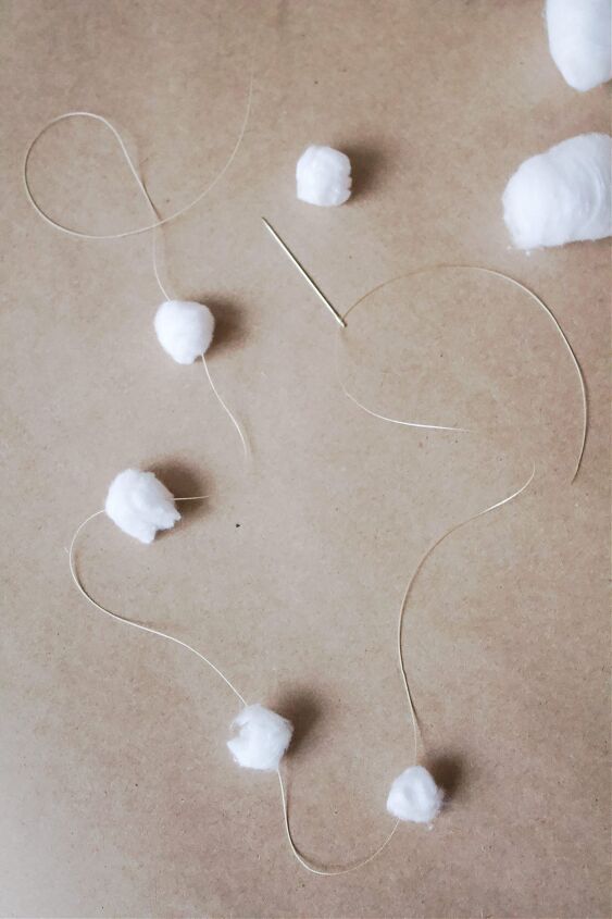 snow garland with cotton balls and string creating a winter wonderla