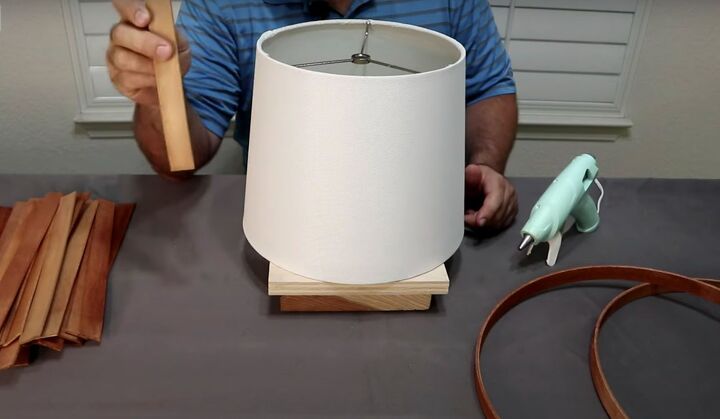 how to make a simple but beautiful paint stick lamp, Use a few extra paint stirrers