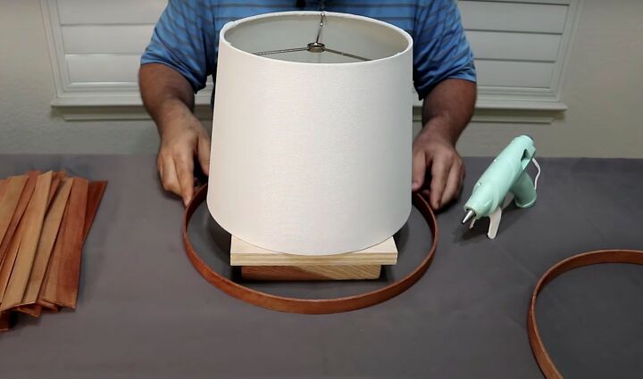 how to make a simple but beautiful paint stick lamp, Put an embroidery hoop around your lampshade