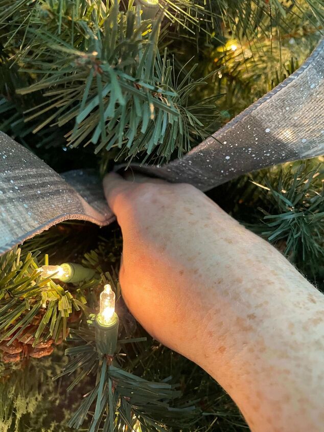 how to decorate a skinny tree with ribbon like a pro, Step 4 Tuck the middle in
