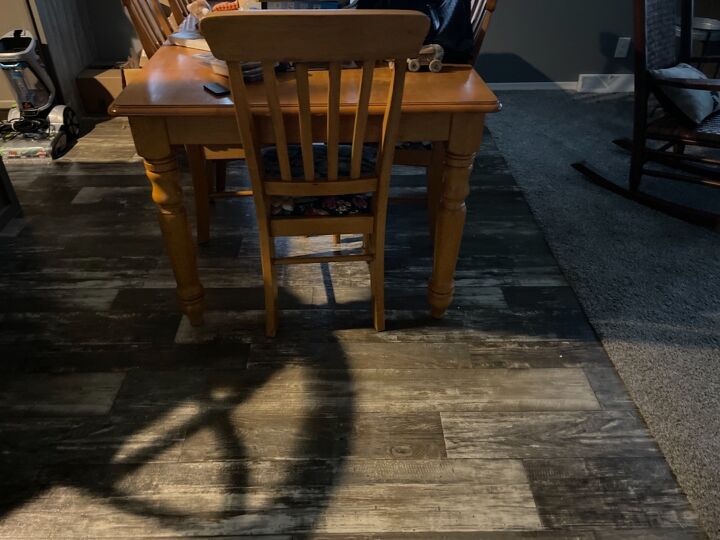 q over large dining table transition across 2 types of flooring