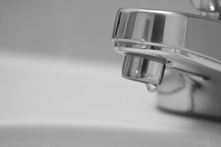 how to fix a leaky faucet before it makes a dent on your water bill, water dripping out of faucet