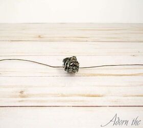 Use a single, tiny pine cone to make your table more beautiful for your guests