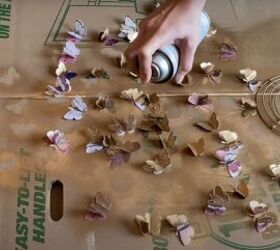 She spray paints paper butterflies and ends up with a show-stopping wall idea