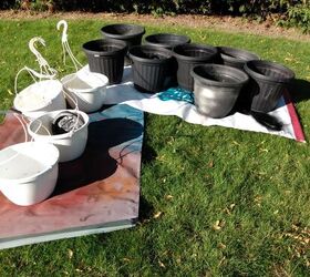 She collects 10 plastic planters to get this beautiful winter porch look