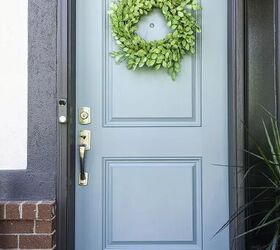 how to paint a front door, light blue front door with green wreath