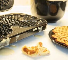 how to clean a waffle iron the right way, dirty waffle iron and plate of cooked waffles