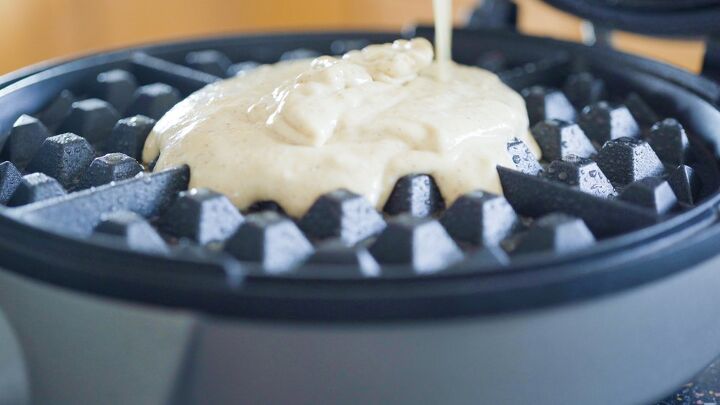 how to clean a waffle iron the right way, batter dripping onto a waffle iron