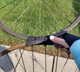 She taped together bike wheels for a $2 idea that might just be our favorite yard decor of the season