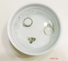 how to clean gold jewelry so it shines like new, three gold rings in a white bowl