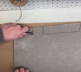 make a festive diy christmas doormat to welcome your guests, Cutting out the rooftops using a box cutter