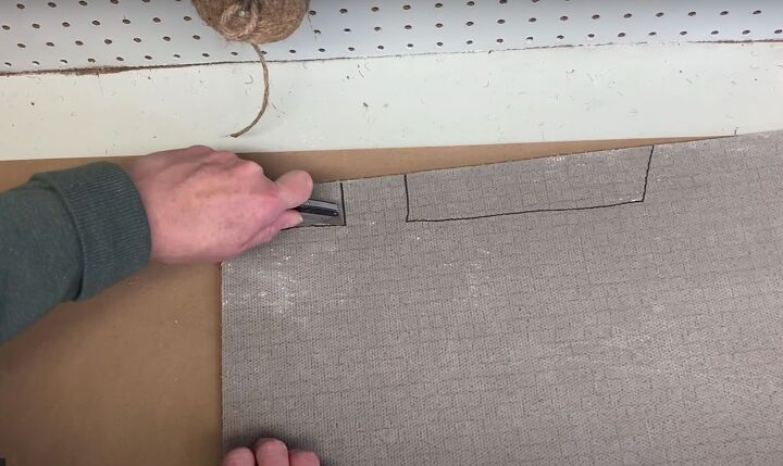 make a festive diy christmas doormat to welcome your guests, Cutting out the rooftops using a box cutter