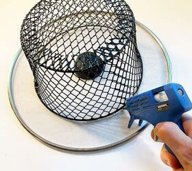 She glues a basket to a pot lid and makes some Frosty-approved decor