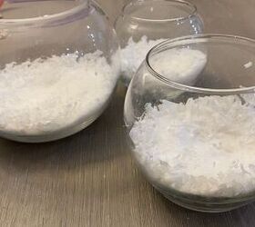 She pours fake snow into 3 fishbowls for this countertop idea that will amaze your guests