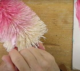 make a pink ombre christmas tree with this easy tutorial, Painting a pale pink shade near the bottom of the bottle brush tree