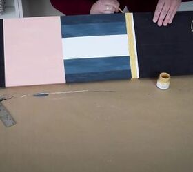 christmas dcor how to make a diy giant nutcracker, Painting the belt of the giant nutcracker in gold