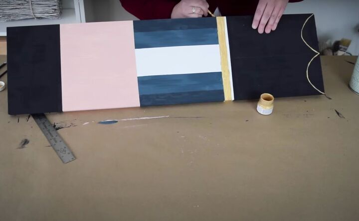 christmas dcor how to make a diy giant nutcracker, Painting the belt of the giant nutcracker in gold
